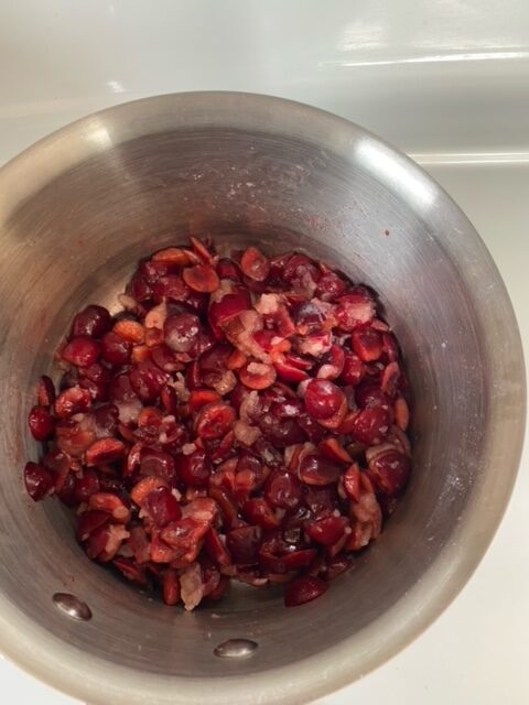 Cherries added to the saucepan.