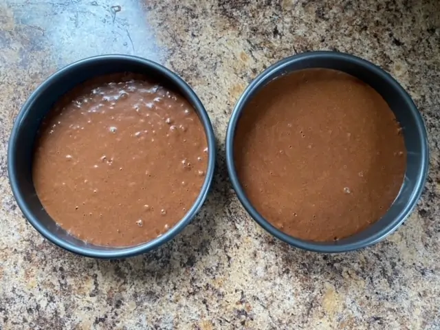Cake batter in two cake pans.