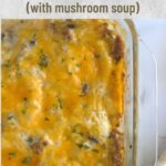 Pierogi casserole in a clear baking dish. An orange dish towel is beside it.