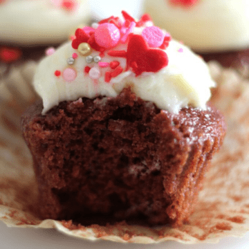 A cupcake with a bite in it.