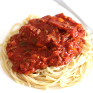 A plate of spaghetti with meat sauce