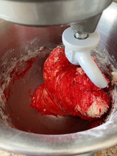 coloured dough in a stand mixer.