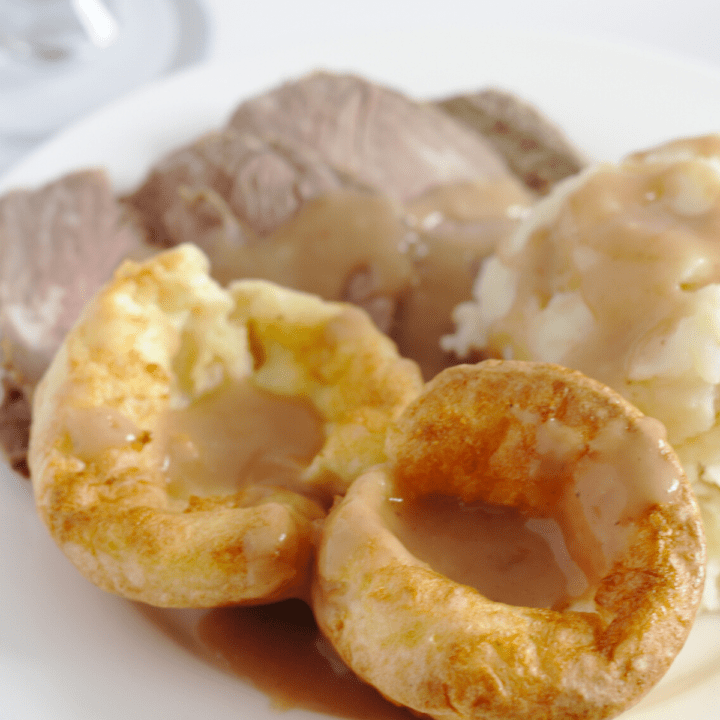 Yorkshire Puddings on a dinner plate.