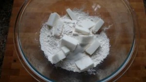 shortening in a bowl of flour, sugar and salt.