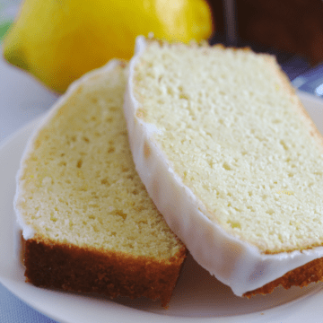 Two slices of lemon loaf on a plate.