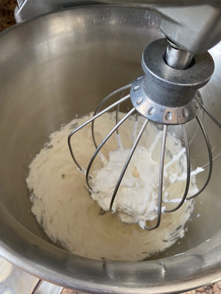 Heavy whipping cream, sugar, and vanilla whipped to stiff peaks.