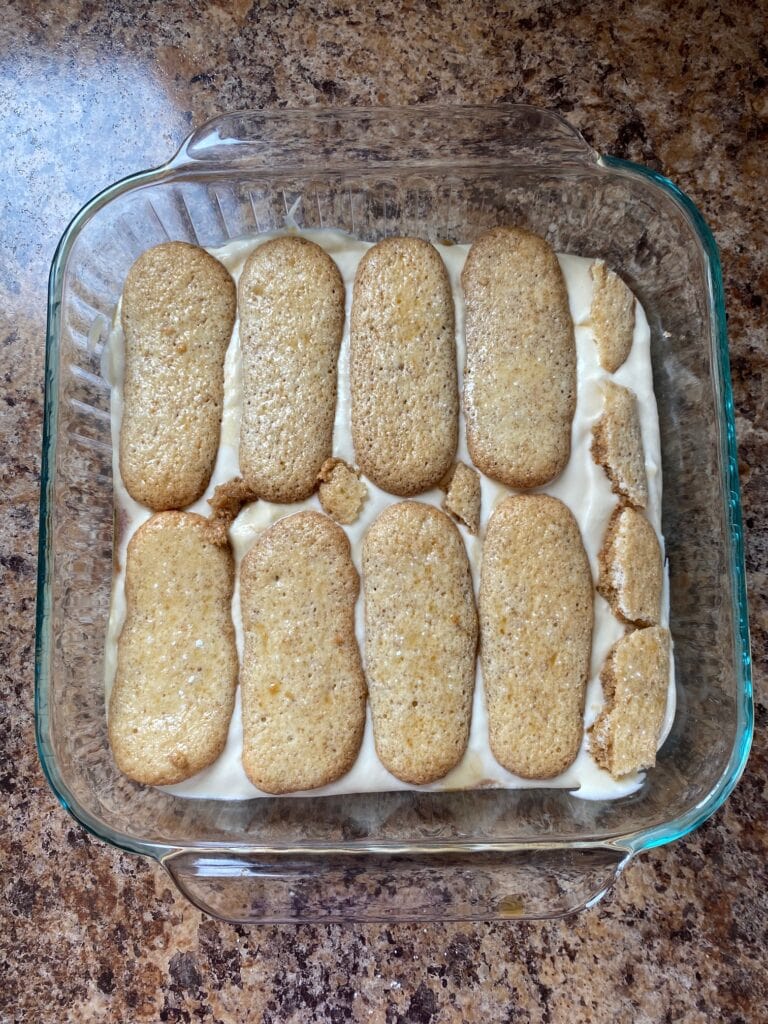 Another layer of ladyfingers in a baking dish.