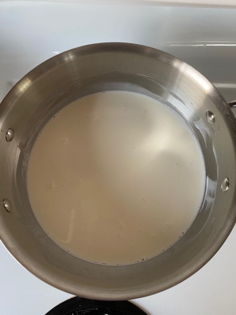 Milk, whipping cream, and sugar in a saucepan.
