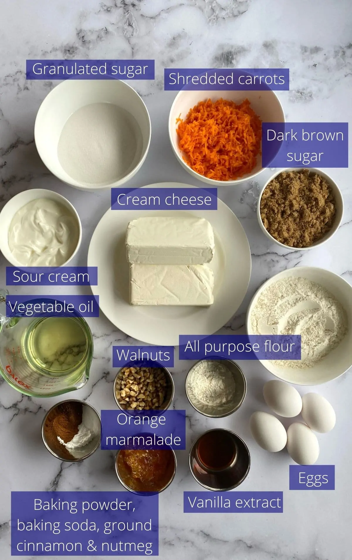 Ingredients needed to make carrot cake cheesecake.