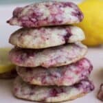 Five cookies stacked on top of each other. Part of a lemon is in the background.