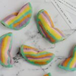Fortune cookies scattered around on a marble surface.