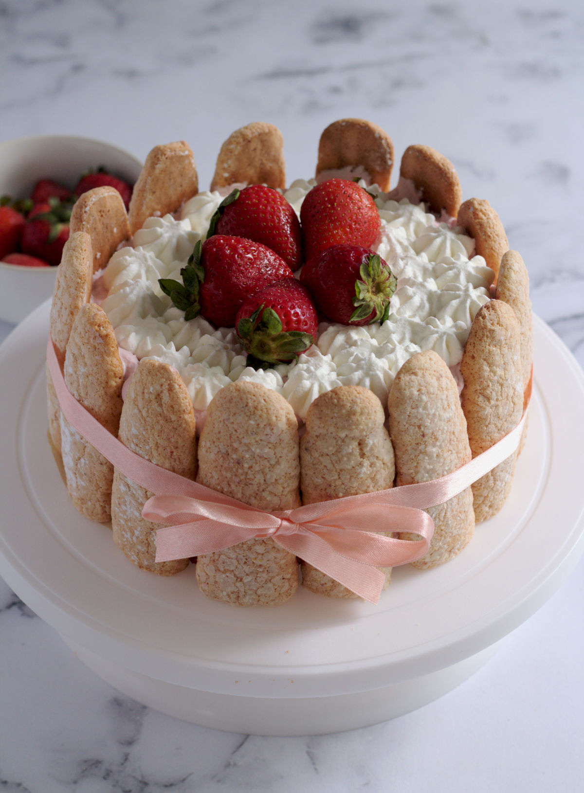 The cake on a white cake stand.