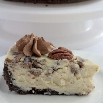 A slice of cheesecake on a white plate.