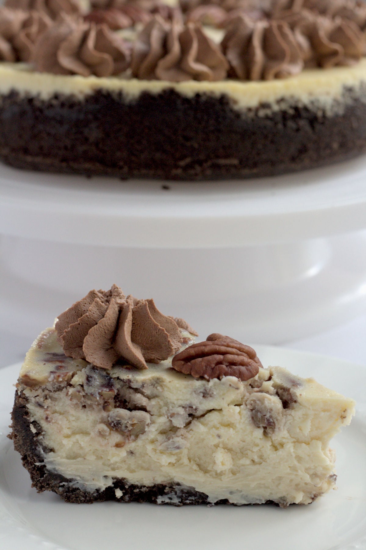 A slice of cheesecake on a white plate.