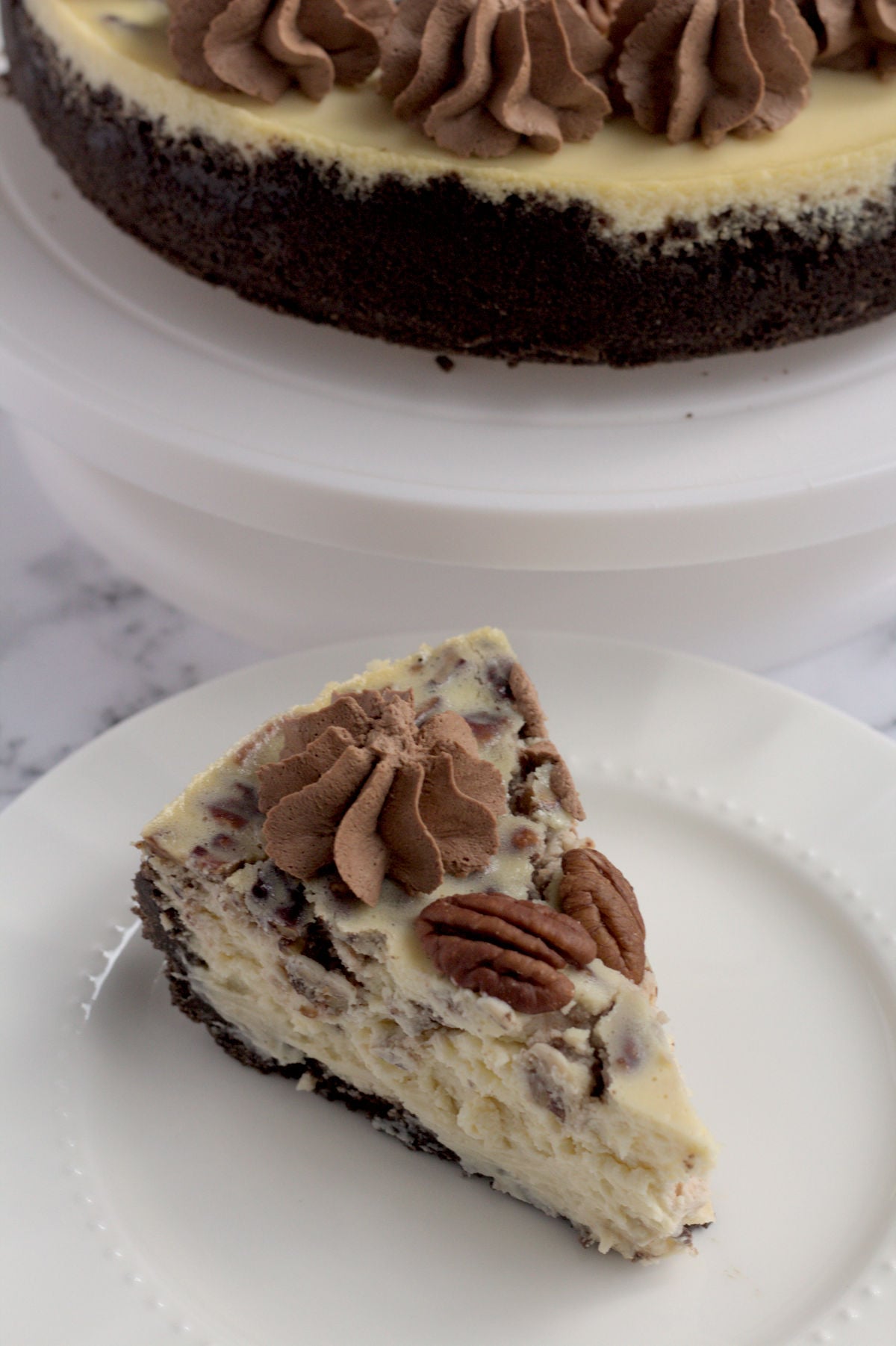 A slice of cheesecake on a white plate.
